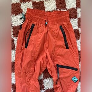 Outdoor Afro x REI Trail Pants Orange
